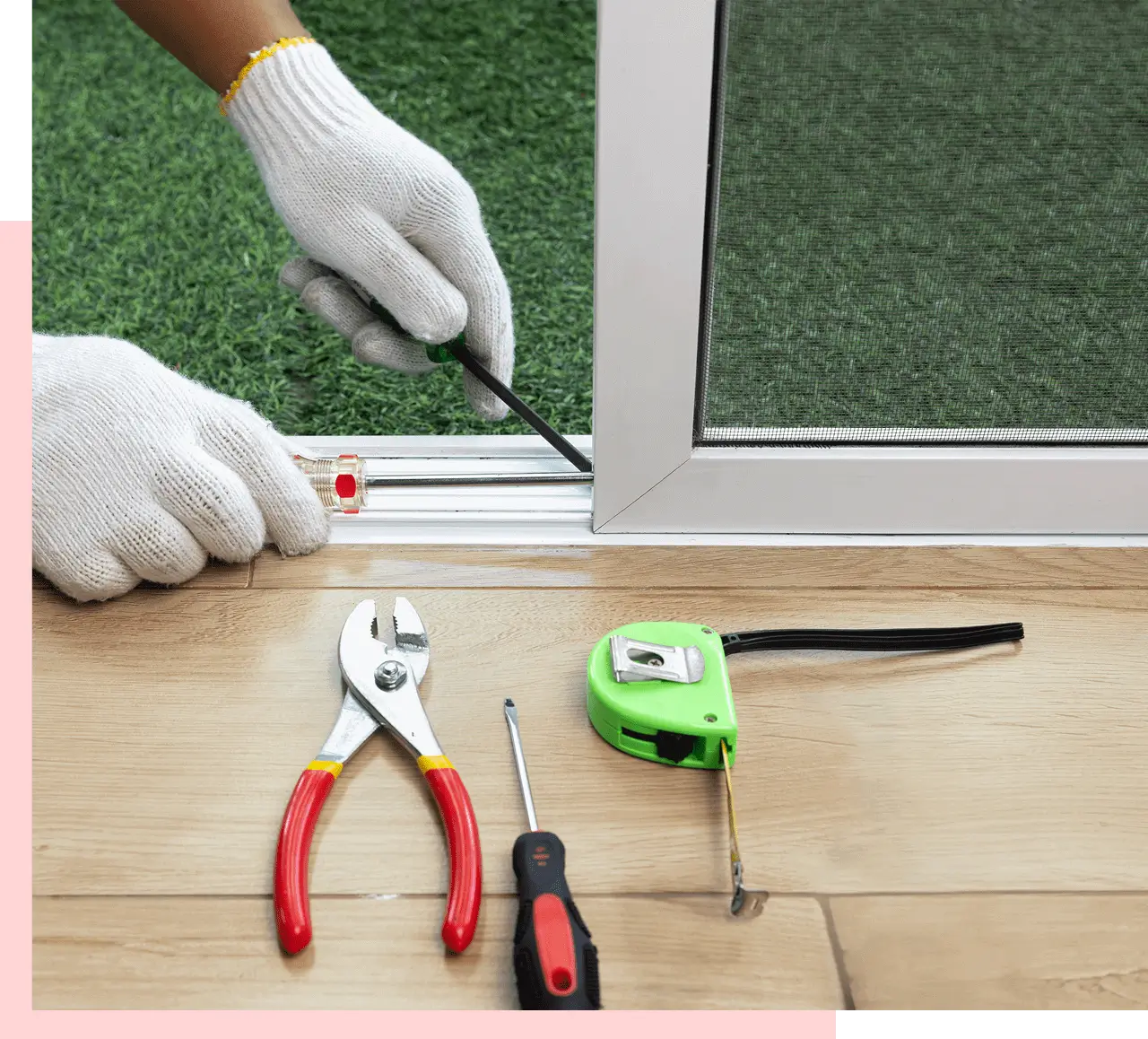 Person installing window frame with tools nearby.